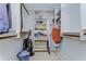 Spacious walk-in closet with built-in shelving and racks for optimal organization and storage at 2663 Sequoia Ter # 2663, Palm Harbor, FL 34683