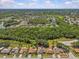 Expansive aerial view of the neighborhood, showcasing the property's location amidst serene lakes and lush greenery at 28628 Twinbrook # Ln, Wesley Chapel, FL 33543