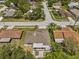 A captivating aerial view of a home featuring a screened patio and mature trees in a vibrant neighborhood at 28628 Twinbrook # Ln, Wesley Chapel, FL 33543