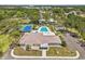 Overhead view showcases the community center with tennis courts, pool, and parking area at 28628 Twinbrook # Ln, Wesley Chapel, FL 33543