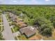 Aerial view of the home showcasing its proximity to a serene pond and lush green trees at 28628 Twinbrook # Ln, Wesley Chapel, FL 33543