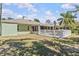 Well-kept backyard featuring a privacy fence, a covered patio, and plenty of space for gardening or play at 28628 Twinbrook # Ln, Wesley Chapel, FL 33543