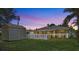 Lovely backyard with a manicured lawn, privacy fence, and a convenient storage shed at 28628 Twinbrook # Ln, Wesley Chapel, FL 33543