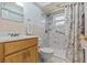 Bathroom featuring a vanity, toilet, and shower with a marble-look surround at 28628 Twinbrook # Ln, Wesley Chapel, FL 33543