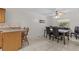 Bright dining area with modern table, chairs, and breakfast bar with view of dining area at 28628 Twinbrook # Ln, Wesley Chapel, FL 33543
