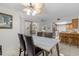 Bright dining area with modern table, chairs, ceiling fan and sliding glass door to the outside at 28628 Twinbrook # Ln, Wesley Chapel, FL 33543