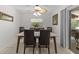 Well-lit dining area with contemporary table, chairs, and view of the outdoor area at 28628 Twinbrook # Ln, Wesley Chapel, FL 33543