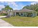Well-maintained home featuring lush landscaping, a manicured lawn, and a welcoming facade at 28628 Twinbrook # Ln, Wesley Chapel, FL 33543