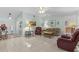 Open living room with neutral decor, tile flooring, and plenty of natural light at 28628 Twinbrook # Ln, Wesley Chapel, FL 33543