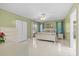 Spacious main bedroom with tile flooring, ensuite bathroom, walk-in closet, and sliding glass door at 28628 Twinbrook # Ln, Wesley Chapel, FL 33543