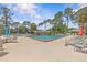 Inviting community pool area with ample seating and clear blue water, perfect for relaxation and recreation at 28628 Twinbrook # Ln, Wesley Chapel, FL 33543