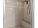 Shower features sleek tilework, a built-in bench, and a modern showerhead at 28628 Twinbrook # Ln, Wesley Chapel, FL 33543