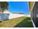 Fenced backyard view showing ample green space, perfect for outdoor activities at 3015 Azalea Blossom Dr, Plant City, FL 33567