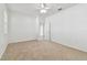 Clean bedroom with neutral carpet and ceiling fan, bathed in natural light at 3015 Azalea Blossom Dr, Plant City, FL 33567