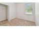 Bedroom featuring neutral carpet, natural light, and closet at 3015 Azalea Blossom Dr, Plant City, FL 33567