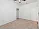 Bedroom featuring neutral carpet, ceiling fan, and walk-in closet at 3015 Azalea Blossom Dr, Plant City, FL 33567