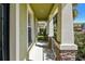 Covered front porch featuring decorative columns and stone accents at 3015 Azalea Blossom Dr, Plant City, FL 33567