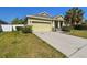 Single-Gathering home featuring well-kept lawn, concrete driveway, and an attached garage at 3015 Azalea Blossom Dr, Plant City, FL 33567