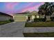 Charming single-Gathering home with manicured lawn, paved driveway, and welcoming curb appeal at 3015 Azalea Blossom Dr, Plant City, FL 33567