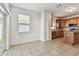 Spacious kitchen conveniently connects to a tiled sunroom with outdoor access at 3015 Azalea Blossom Dr, Plant City, FL 33567
