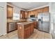 Well-equipped kitchen featuring stainless steel appliances and a central island at 3015 Azalea Blossom Dr, Plant City, FL 33567