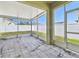 Covered patio with white vinyl fencing and tile flooring at 3015 Azalea Blossom Dr, Plant City, FL 33567