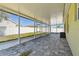 View of the large, screened-in lanai with a neutral color scheme provides great light at 3015 Azalea Blossom Dr, Plant City, FL 33567