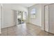 Bright sunroom with tiled flooring and sliding glass door to screened porch at 3015 Azalea Blossom Dr, Plant City, FL 33567