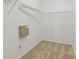 Empty walk-in closet with carpeted floor and wire shelving system at 3015 Azalea Blossom Dr, Plant City, FL 33567