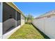 Green side yard with a lush lawn and a privacy fence at 3015 Azalea Blossom Dr, Plant City, FL 33567