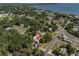 Aerial view showcasing the property's location near the water with lush trees surrounding the neighborhood at 315 Oakwood Blvd, Oldsmar, FL 34677