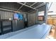 A modern backyard bar setup with a TV offers a unique and stylish entertainment space at 315 Oakwood Blvd, Oldsmar, FL 34677
