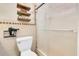 Bathroom features a tiled shower with sliding glass doors and decorative shelving at 315 Oakwood Blvd, Oldsmar, FL 34677