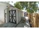 A charming shed provides extra storage space with stylish double doors, and outdoor convenience at 315 Oakwood Blvd, Oldsmar, FL 34677