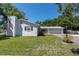 Beautiful home with a well-maintained lawn, spacious driveway, and a charming two-car garage at 315 Oakwood Blvd, Oldsmar, FL 34677
