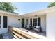 Welcoming front porch featuring comfortable seating, stylish decor, and a charming entrance at 315 Oakwood Blvd, Oldsmar, FL 34677