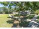 Charming single story home with mature landscaping including mossy, draping oak trees, plus a large front lawn at 315 Oakwood Blvd, Oldsmar, FL 34677