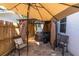 Backyard patio featuring a covered hot tub area and outdoor seating, perfect for relaxation and entertaining at 315 Oakwood Blvd, Oldsmar, FL 34677