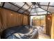 An inviting outdoor hot tub and gazebo create a relaxing and private retreat with a view of the backyard at 315 Oakwood Blvd, Oldsmar, FL 34677