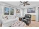 Inviting living room with comfortable seating, ample natural light, and stylish nautical-themed decor at 315 Oakwood Blvd, Oldsmar, FL 34677