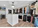 Large walk-in closet with custom shelving, drawers, and a central island at 315 Oakwood Blvd, Oldsmar, FL 34677