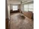 Bedroom with exposed framework, tiled floors, and natural light from two windows at 4031 Bay Ne St, St Petersburg, FL 33703
