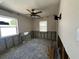 Cozy bedroom with two windows and a ceiling fan ready to be renovated at 4031 Bay Ne St, St Petersburg, FL 33703
