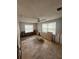 Bedroom with exposed framework, tiled floors, and natural light from two windows at 4031 Bay Ne St, St Petersburg, FL 33703