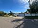 A view of the house and detached garage from the street at 4031 Bay Ne St, St Petersburg, FL 33703