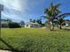 Well maintained front lawn features palm trees at 4031 Bay Ne St, St Petersburg, FL 33703