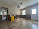 Spacious living room with tile floors and natural light; in need of renovation at 4031 Bay Ne St, St Petersburg, FL 33703
