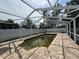 Enclosed pool with weathered brick pavers inside a full screen enclosure at 4031 Bay Ne St, St Petersburg, FL 33703