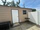 Outdoor shed with a door and window, perfect for outdoor storage in the back yard at 4031 Bay Ne St, St Petersburg, FL 33703
