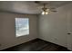 Bright bedroom with a ceiling fan, and a window at 4102 Fox Ridge Blvd, Wesley Chapel, FL 33543